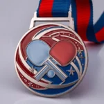 Custom table tennis medal featuring a ping pong ball and a tennis racket design.