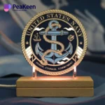 A wooden lamp featuring the US Navy Seal, complemented by navy challenge coins displayed nearby.