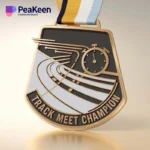 Medal inscribed with "Track Meet Champion," awarded for outstanding performance in track competitions.