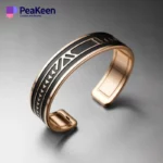Soft enamel peeken bracelet featuring a stylish design in black and gold plated metal, perfect for any occasion.