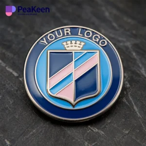 Custom logo pin badge for a club, featuring a vibrant blue and pink crest to represent its identity.